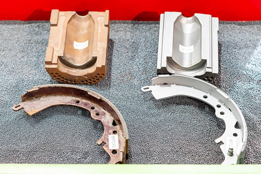 Metal parts and abrasive blasting media